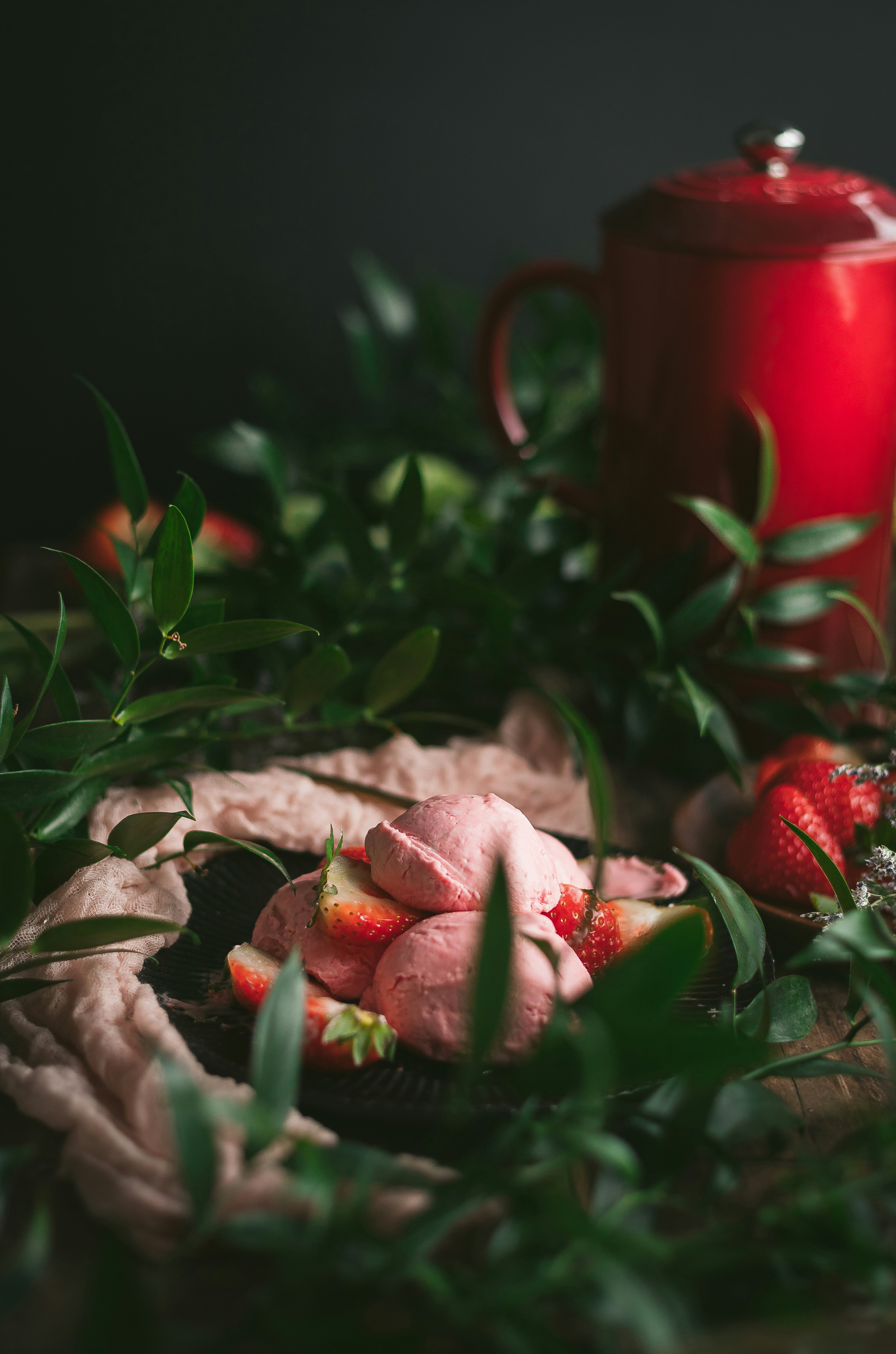 red strawberries on brown wooden table